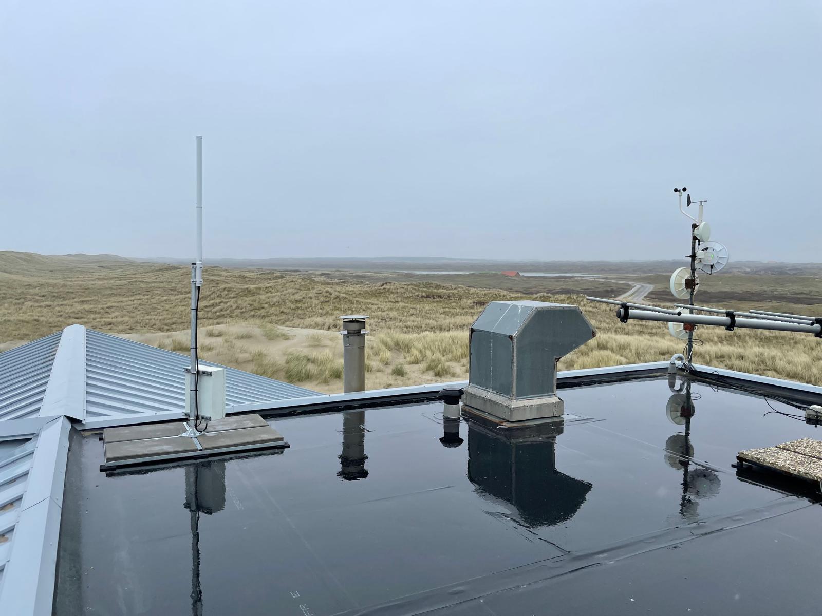 Gateway with weather station on a rooftop near coastal dunes