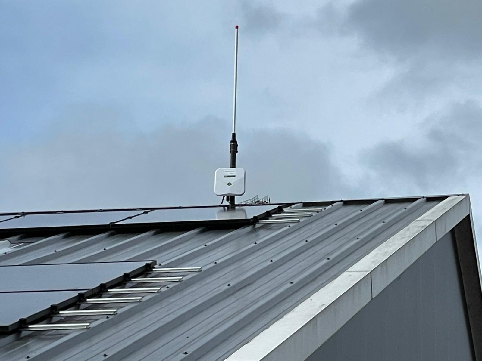 Rooftop gateway installation near solar panels